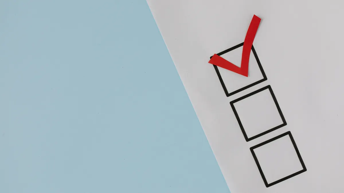 paper checklist with a red check mark